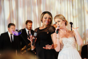 Happy Bride singing with wedding band singer 