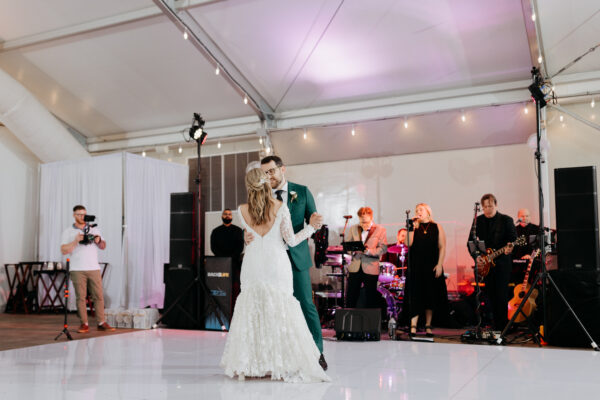 Green suit for groom during first dance by Anna Pantusa Portraits