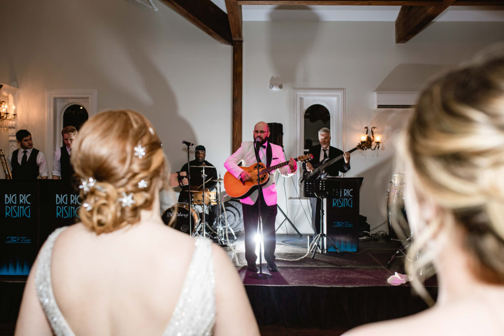 Groom serenading bride on their wedding day