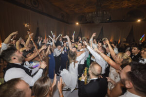 Bride and Groom dancingsurrounded by wedding guests