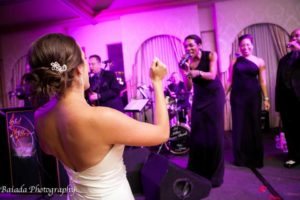 Happy Bride Dancing with Wedding Singer